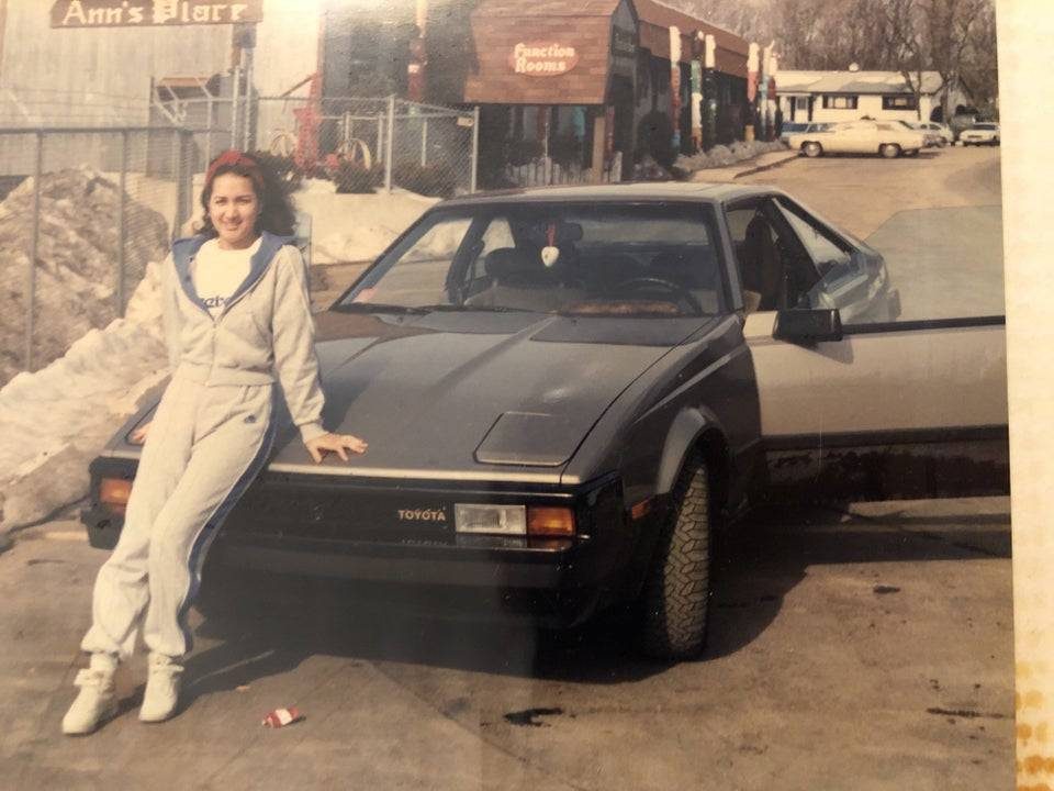 Woman on old car