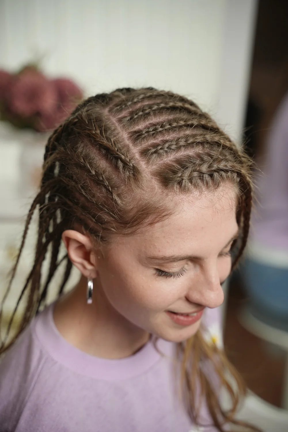 A top close-up shows exactly why this style works: the braids sit in clean layers instead of one flat row.
