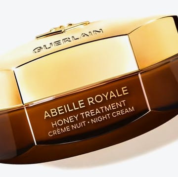 Luxury night cream jar with a golden lid and a brown base